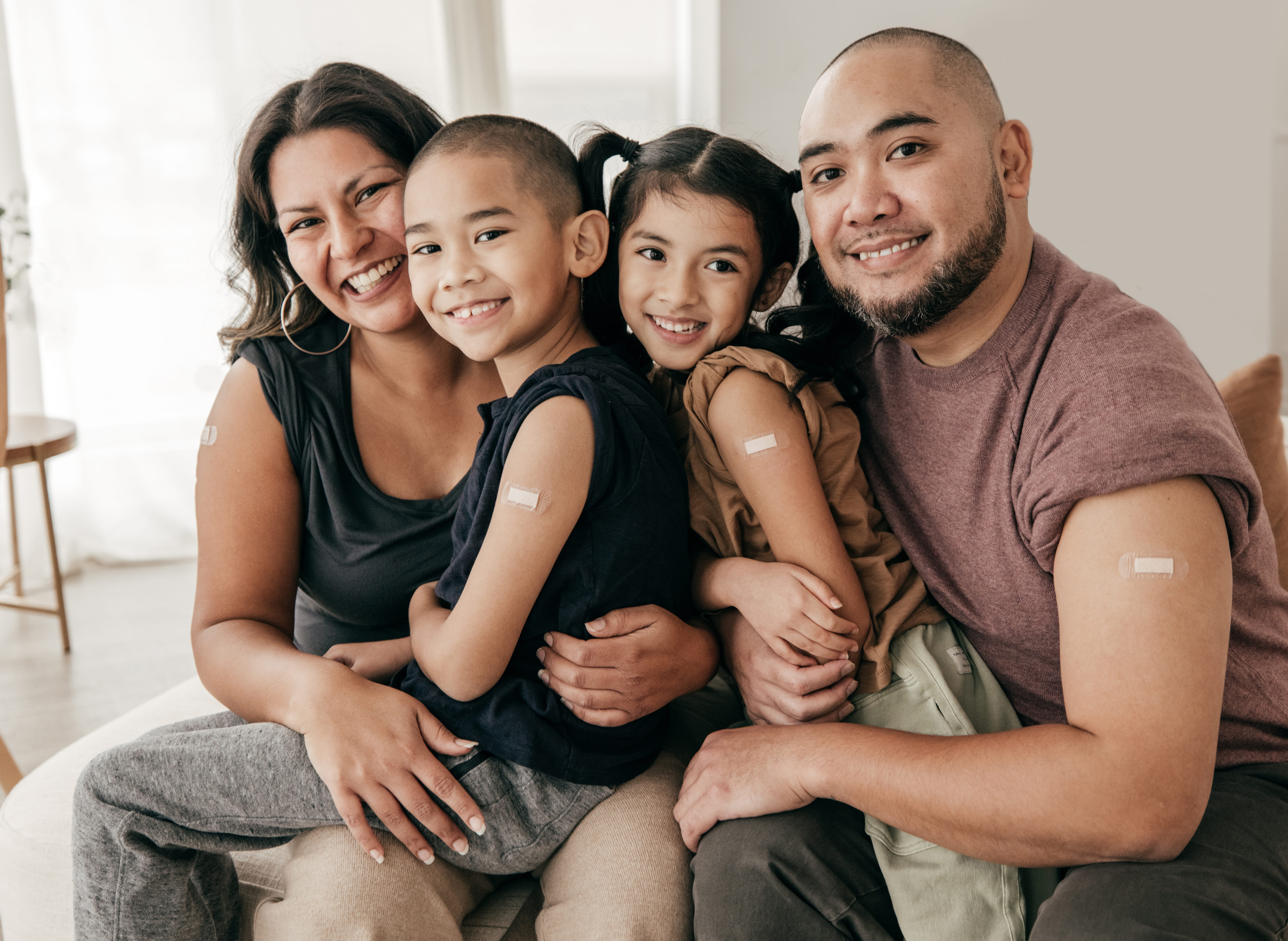 family portrait showing them just getting a flu shot