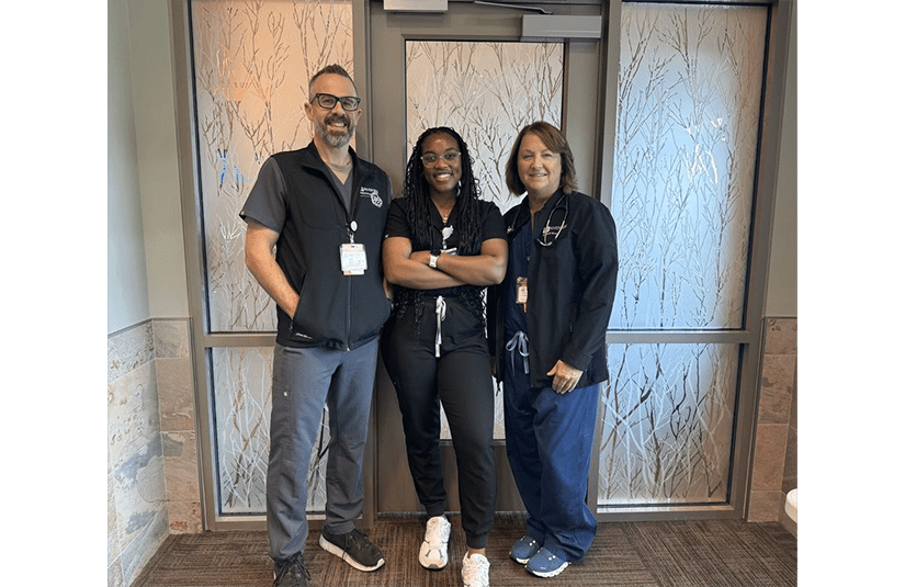 group of people in scrubs smiling 