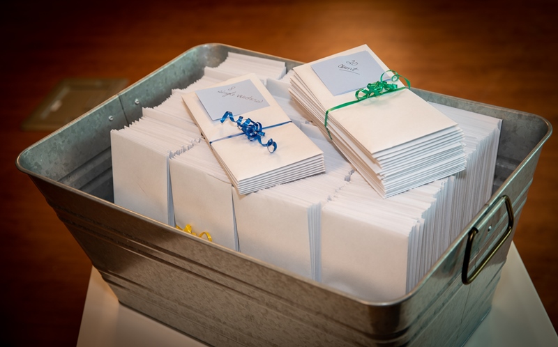 Bucket full of gift envelopes for staff