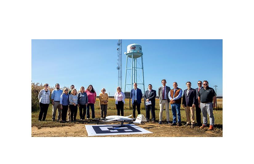A team involved with Elevating Health Care Access displays one of the Kite B drones used in the project