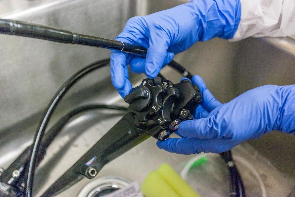 endoscope being cleaned