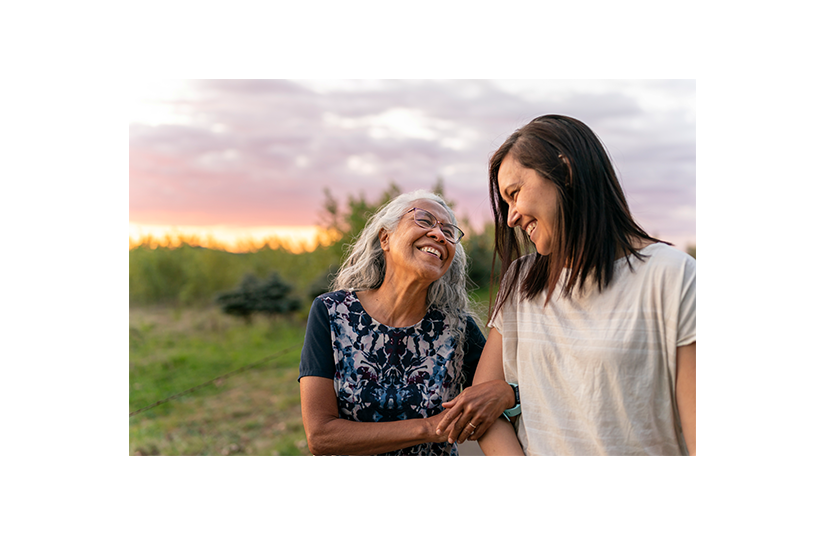 Senior Mother Walking With Her Adult Daughter