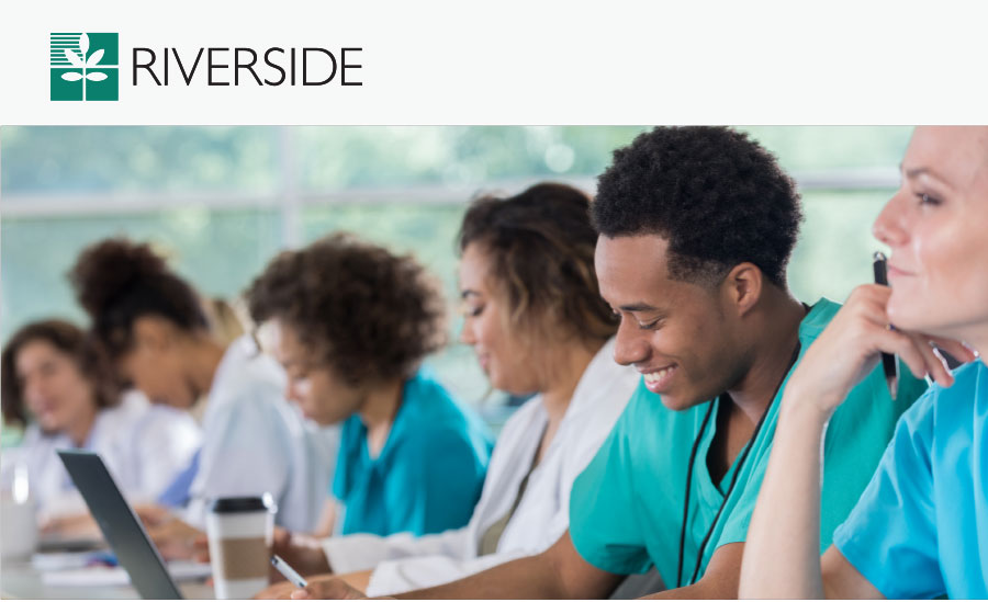 group of diverse nurses sitting in a classroom