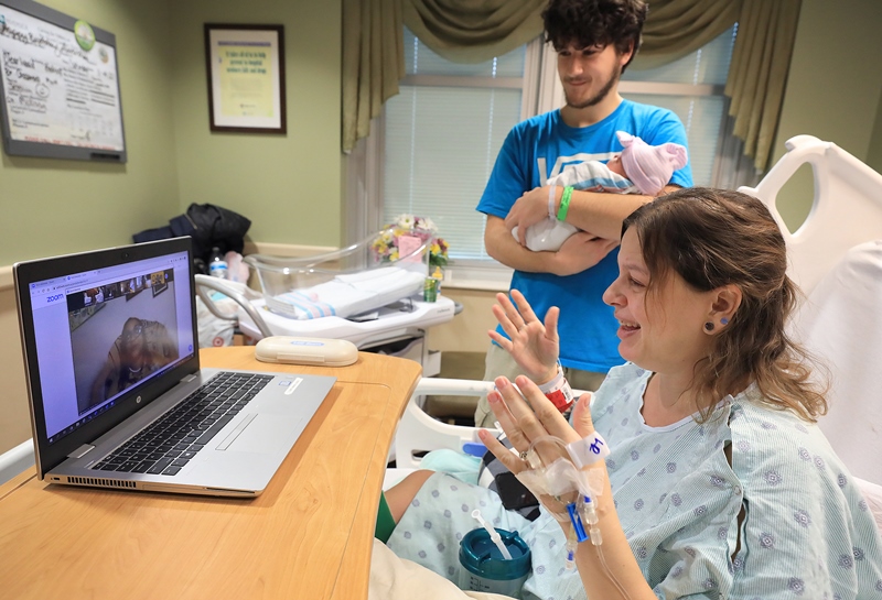 Ethan and Teresa zoom calling with family from the hospital