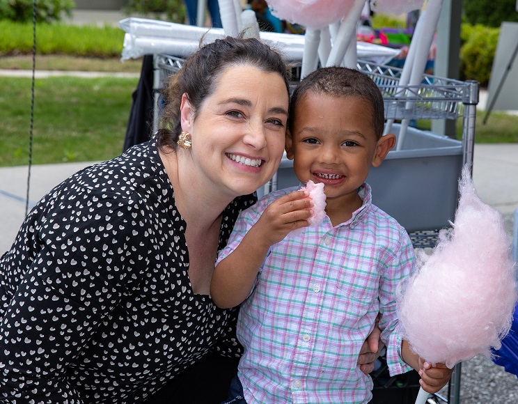 woman and child eating cotton candy