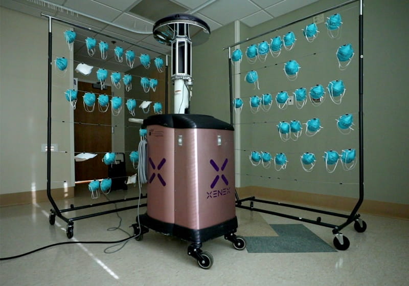 Robotic UV machine disinfecting face masks