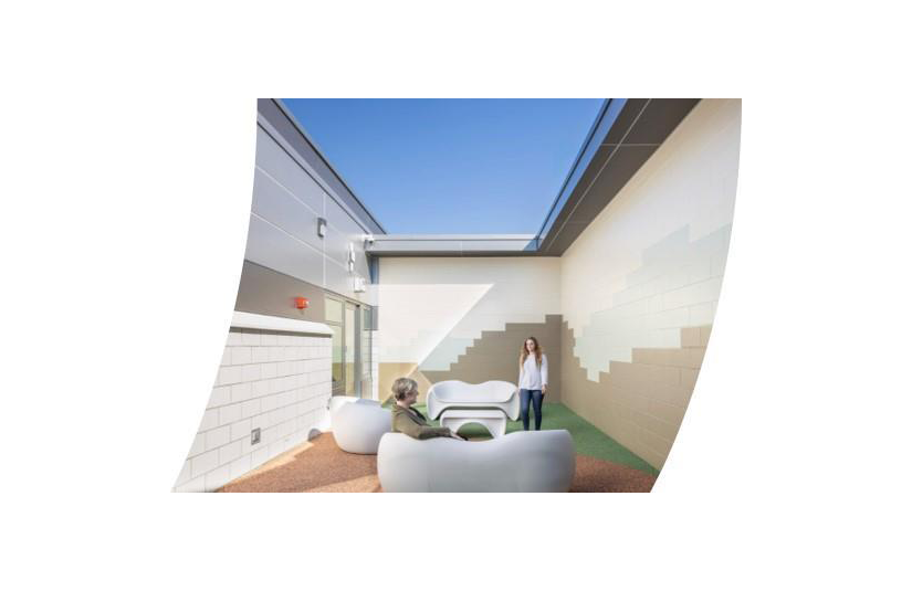 Depiction of adolescent standing in courtyard