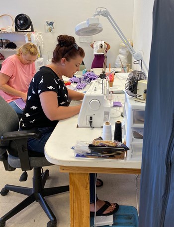 Women sewing new face masks