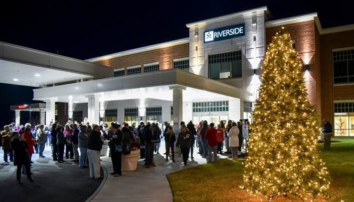 group of people standing in front of riverside shore memorial hospital