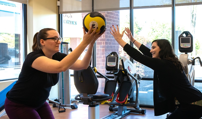 Therapist Guides Patient in Excercises at Riverside Physical Therapy Kiln Creek