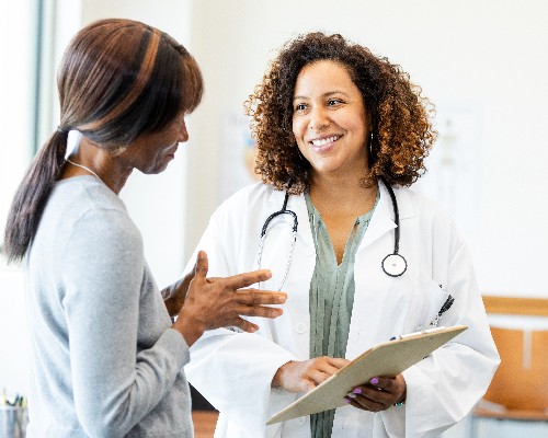 Healthcare provider discussing liver health and treatment options with a patient at Riverside Health, representing hepatology services, liver disease management, specialty care, and the Riverside Health–UVA Health affiliation.