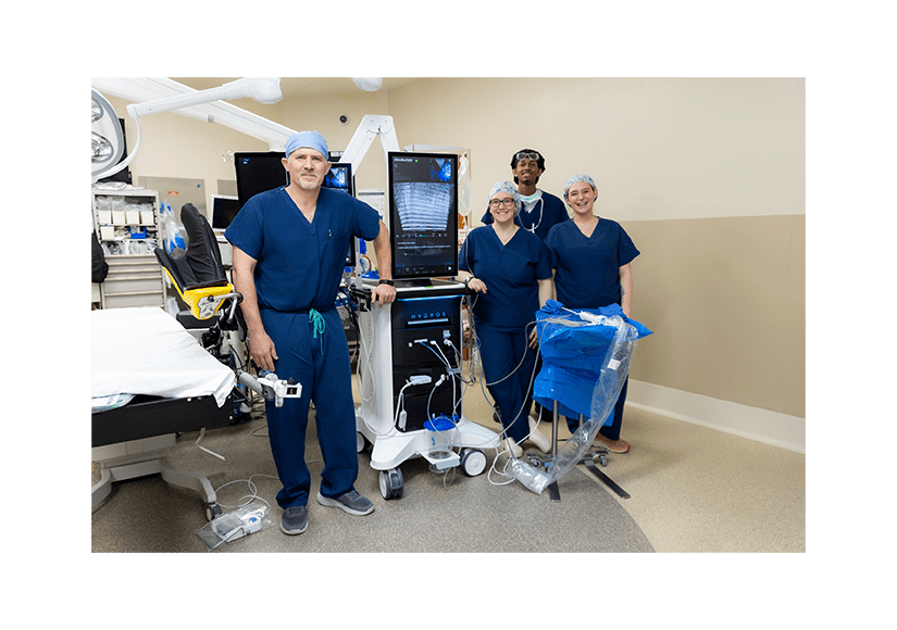 group of people in blue scrubs in an operating room