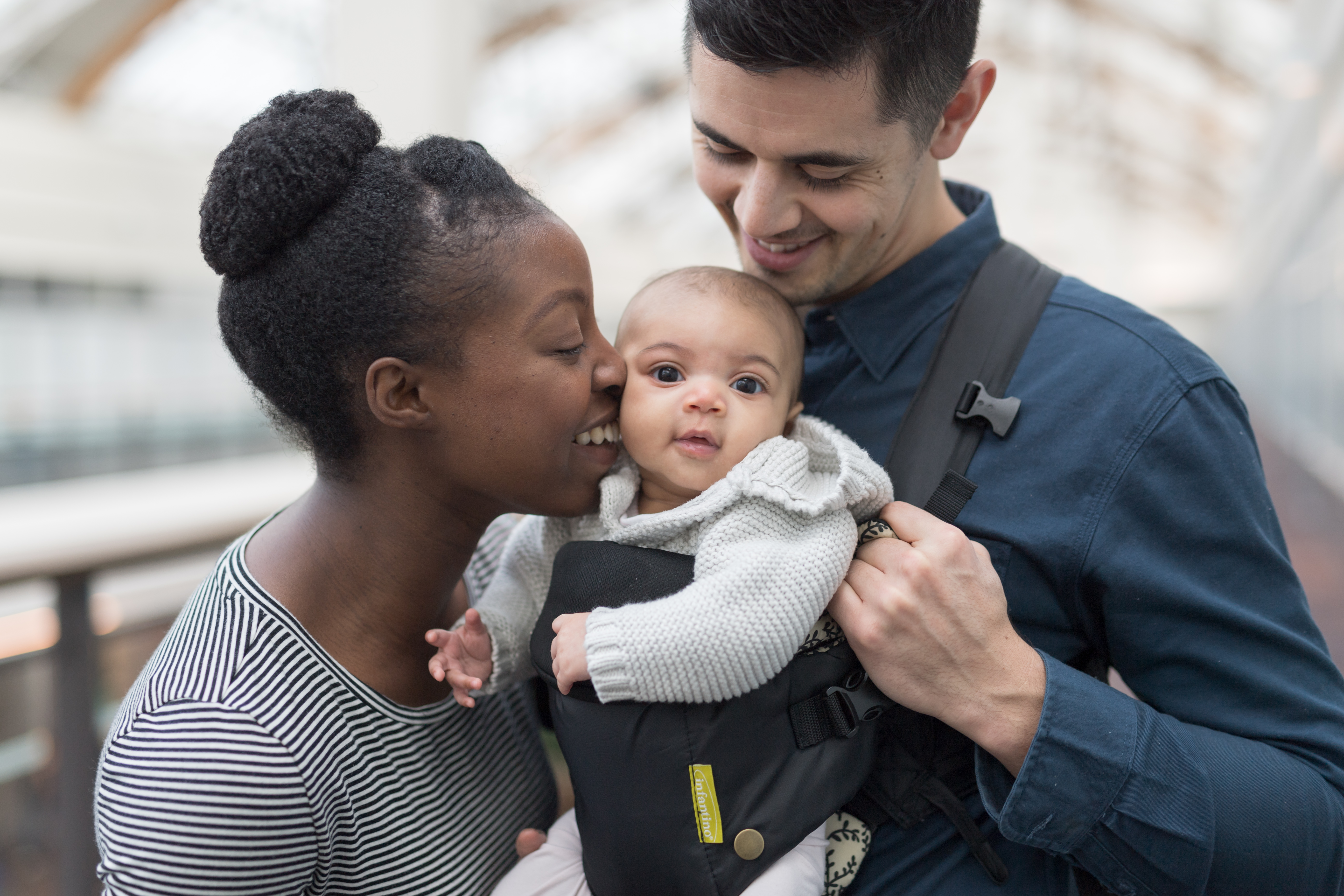 Mother, father and infant together