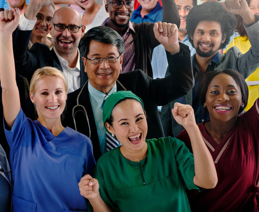 Diverse group of health professionals cheering for each other