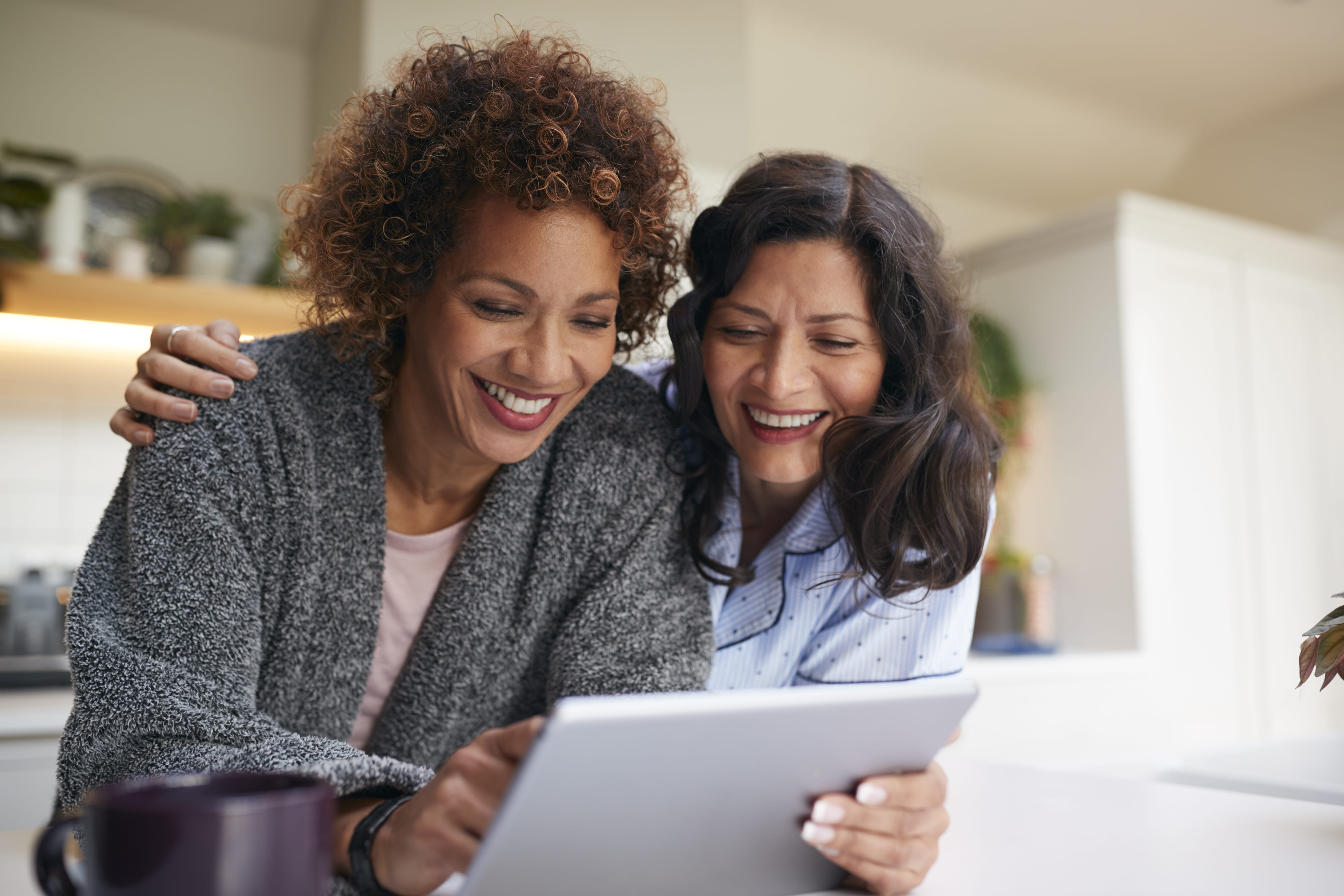 Mother and daughter looking at tablet