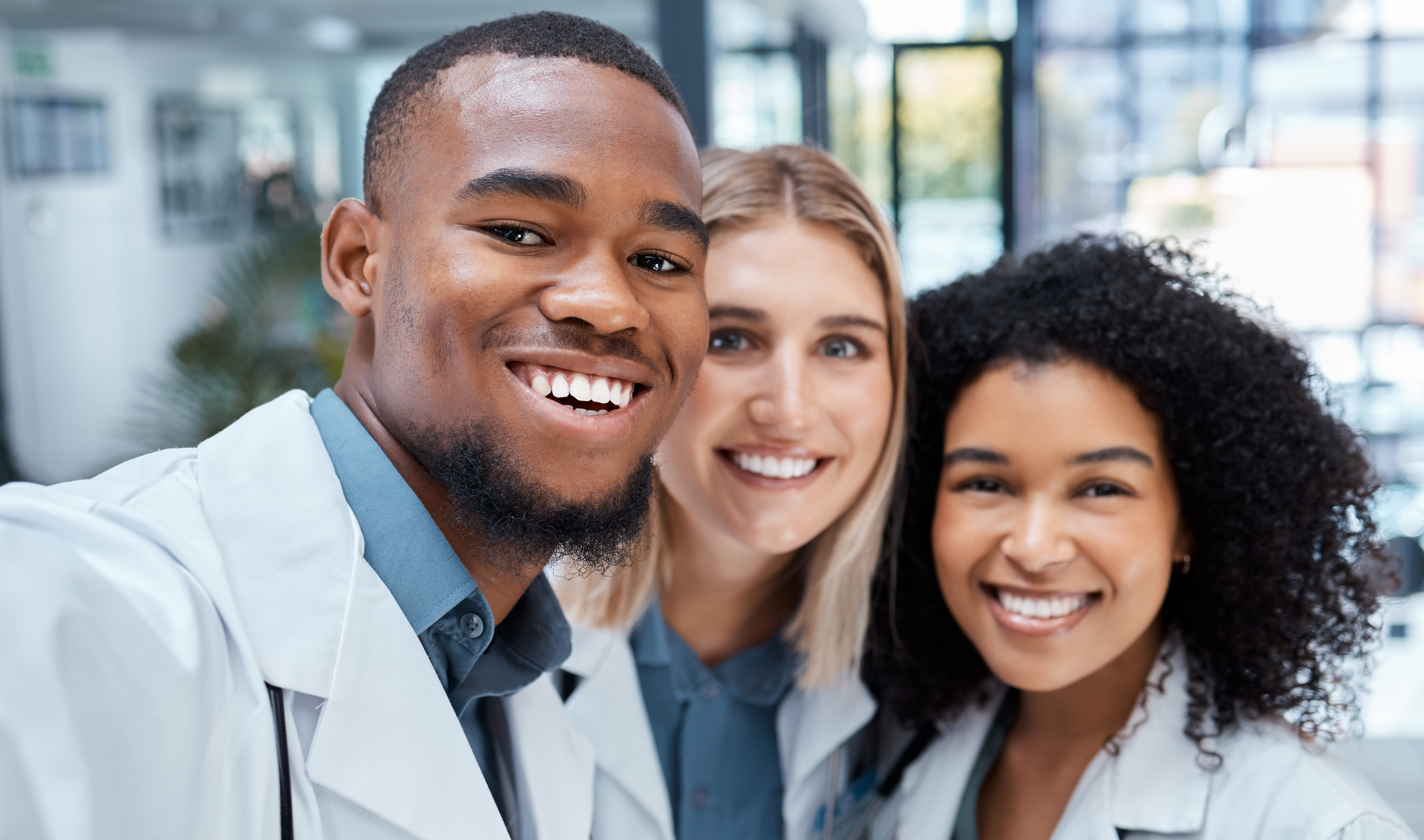 group of diverse medical students smiling at the camera