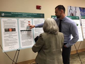 Doctors reviewing research display
