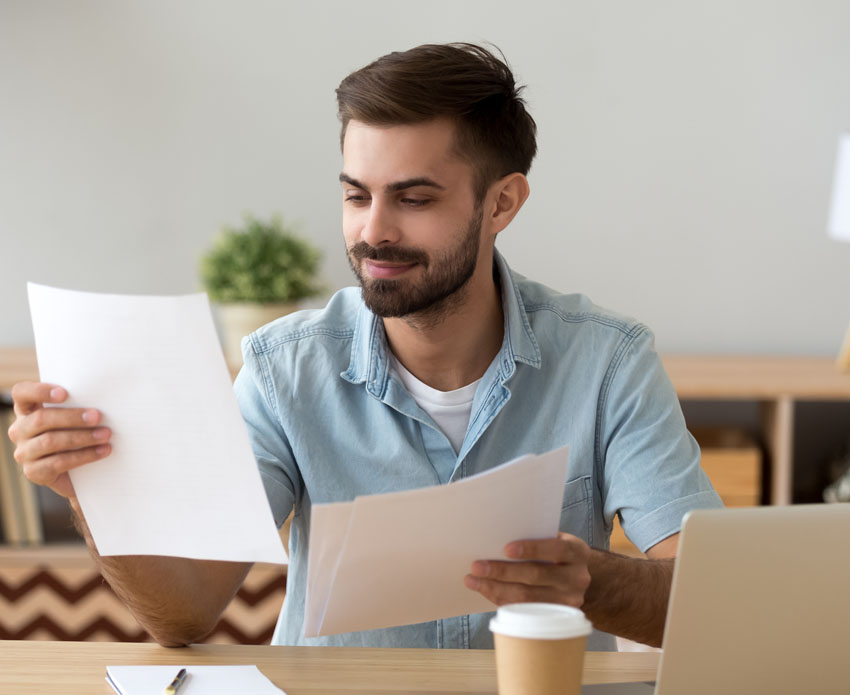 Young male professional preparing documents