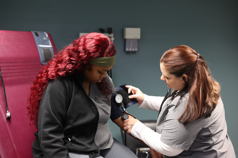 medical assistant attending to patient