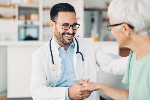 Doctor visiting a senior woman at home