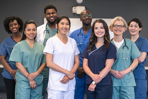 group of diverse men and women nurses standing together