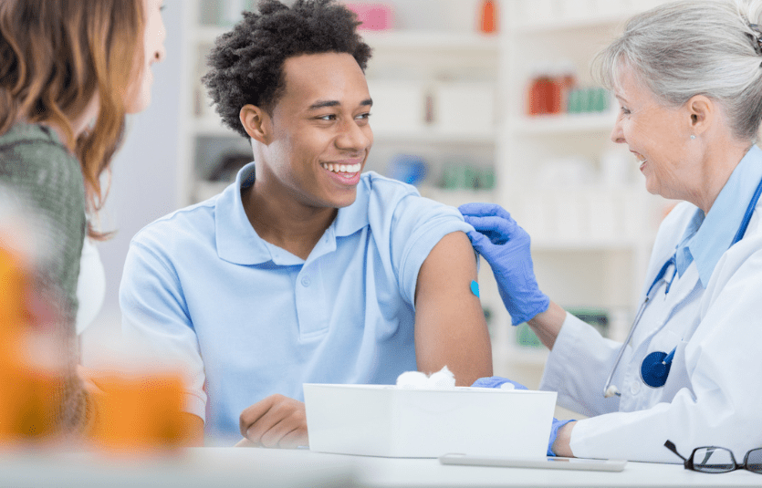 Man of color getting a flu shot