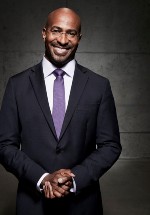 African American Man in a black suit with a purple tie