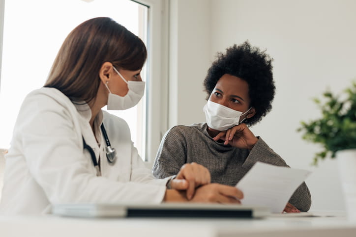 physician and patient having a conversation