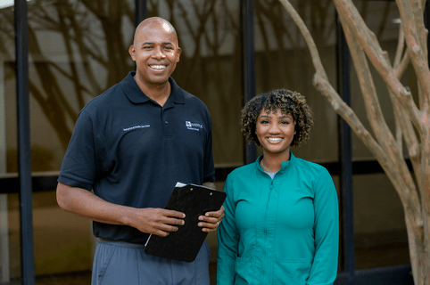 a group photo of two riverside employees