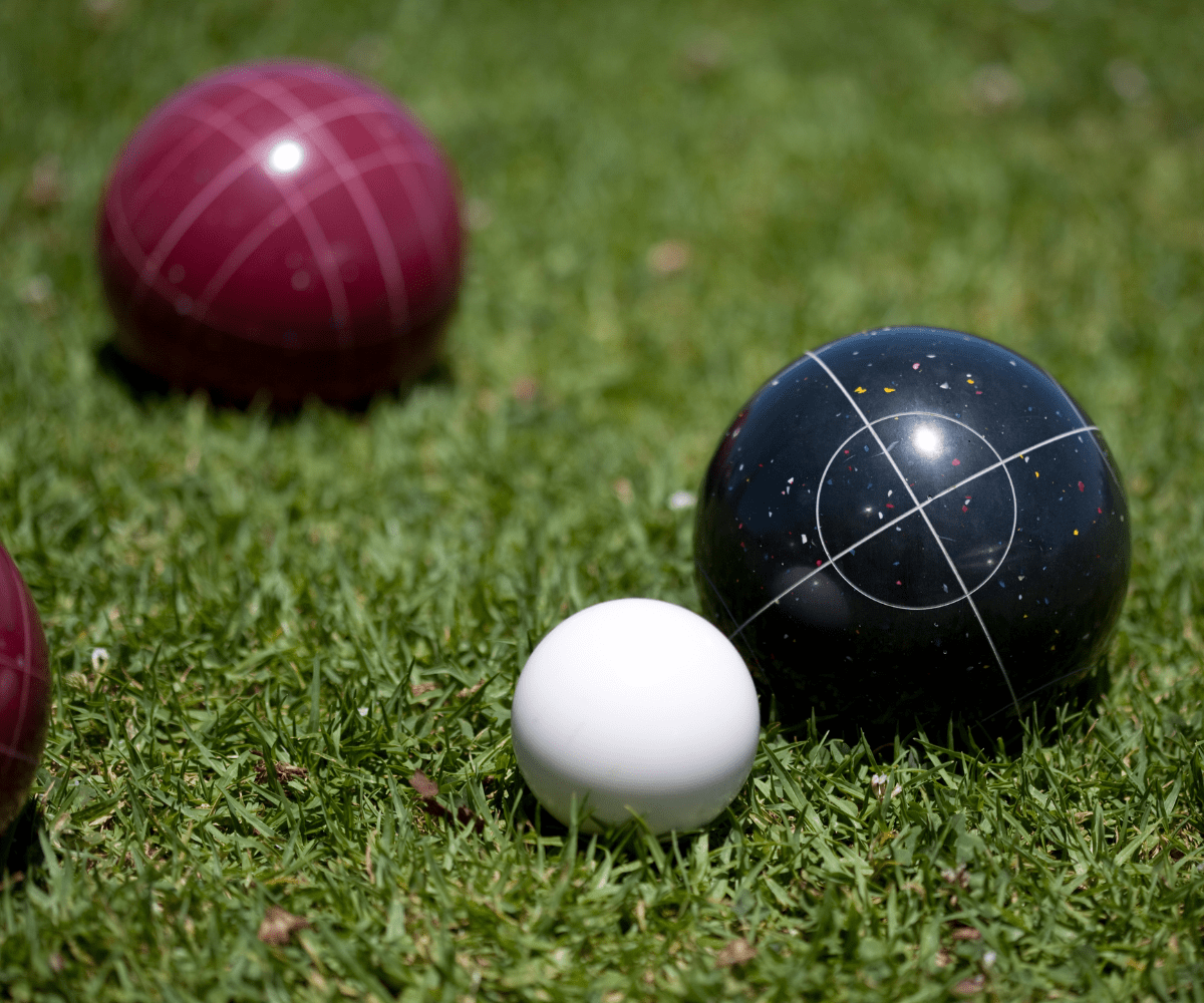 Bocce Ball court with a small white ball on the grass