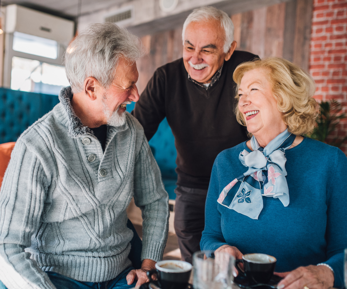 Group of older people sitting together smiling