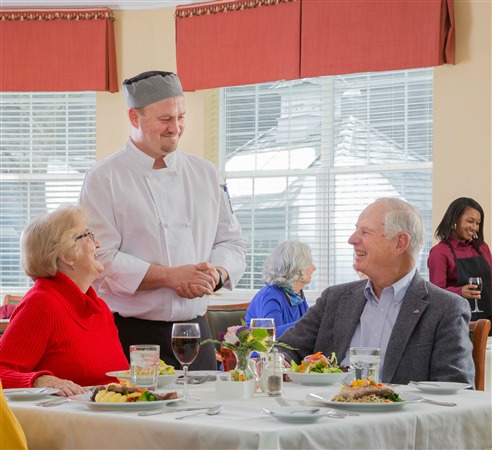 Chef talking to diners
