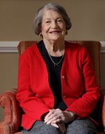 older senior woman smiling in a black shirt