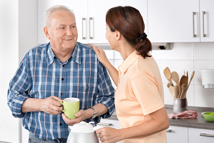 Senior speaking with companion