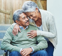 Older Black couple hugging