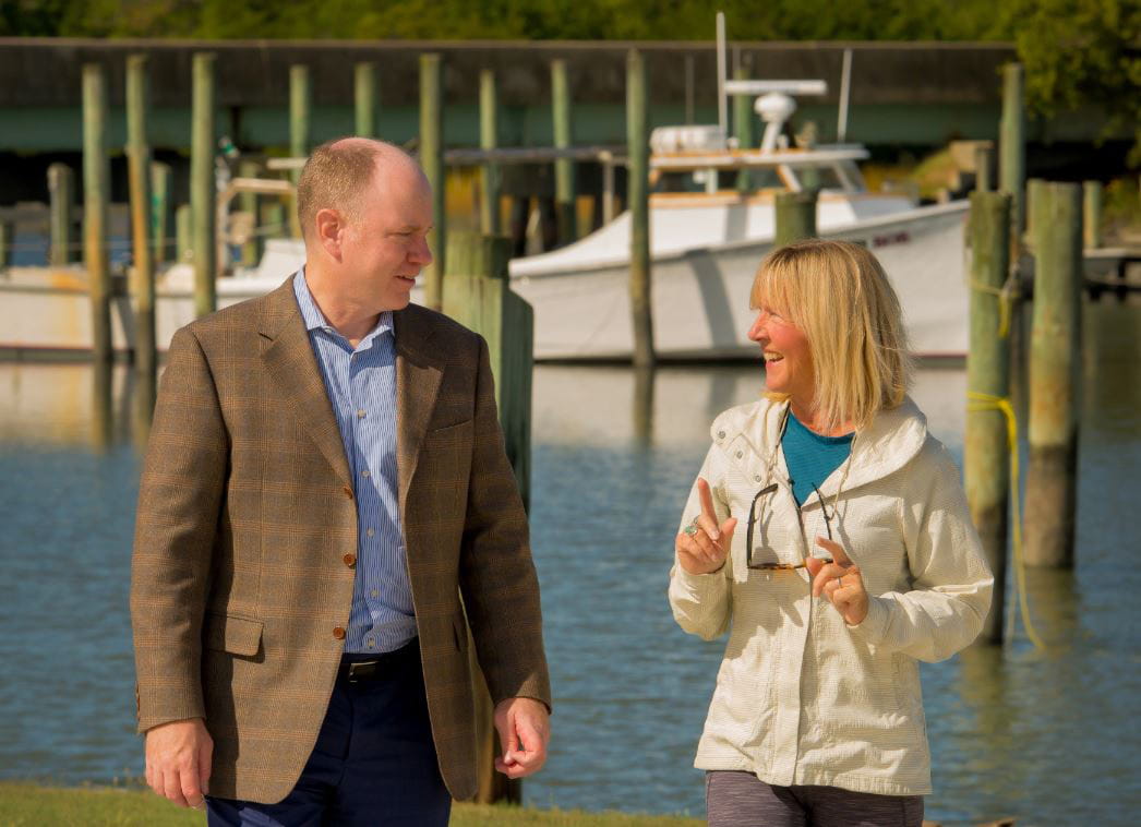 Dr. Moulds and Sarah Trachy walking by a lake