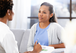 Woman sitting with a provider at a table 