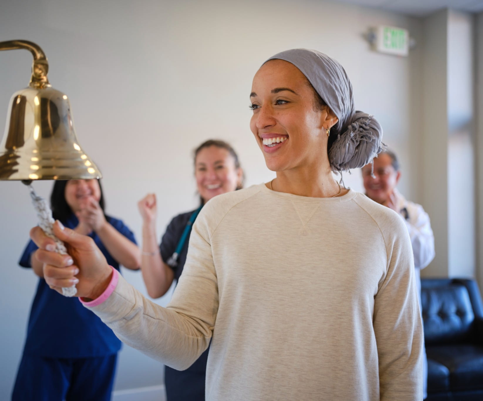 a woman smiling because of the Riverside Cancer Care Network
