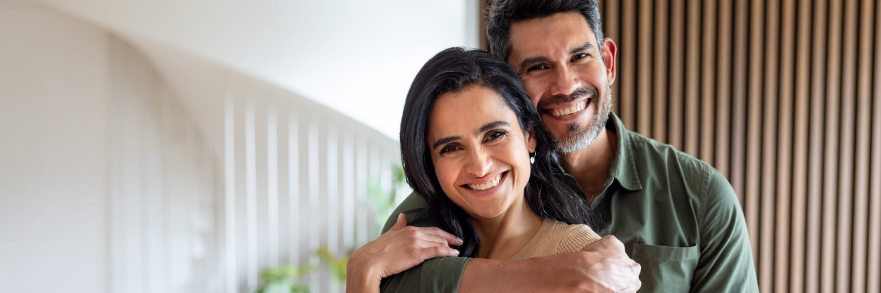 Portrait of a happy loving couple smiling at home