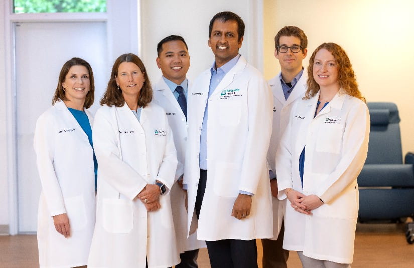 Riverside Health cancer specialists and oncology physicians standing together, representing expert cancer care, multidisciplinary treatment planning, advanced oncology services, and patient-centered cancer treatment.