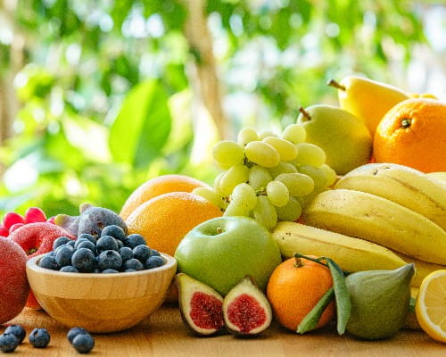 Healthy ripe fruits heap on garden table
