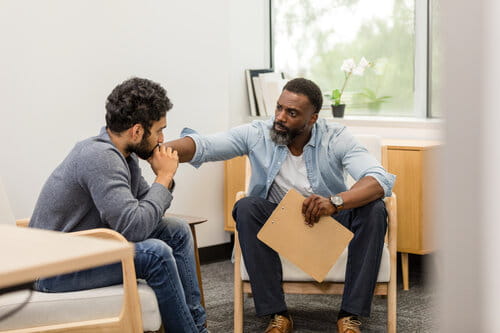 Therapist Comforting a Patient During a Counseling Session