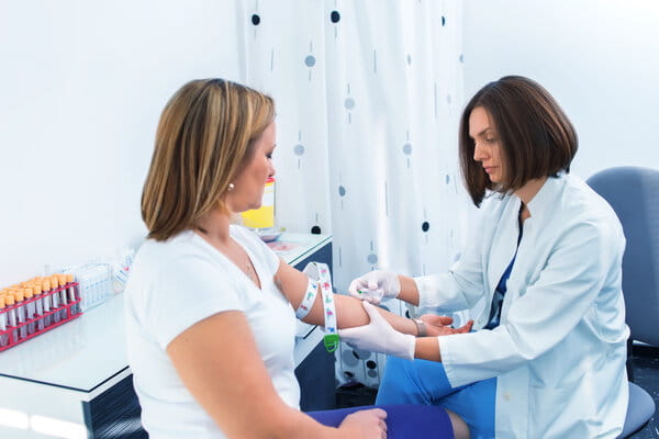 Nurse taking blood sample 