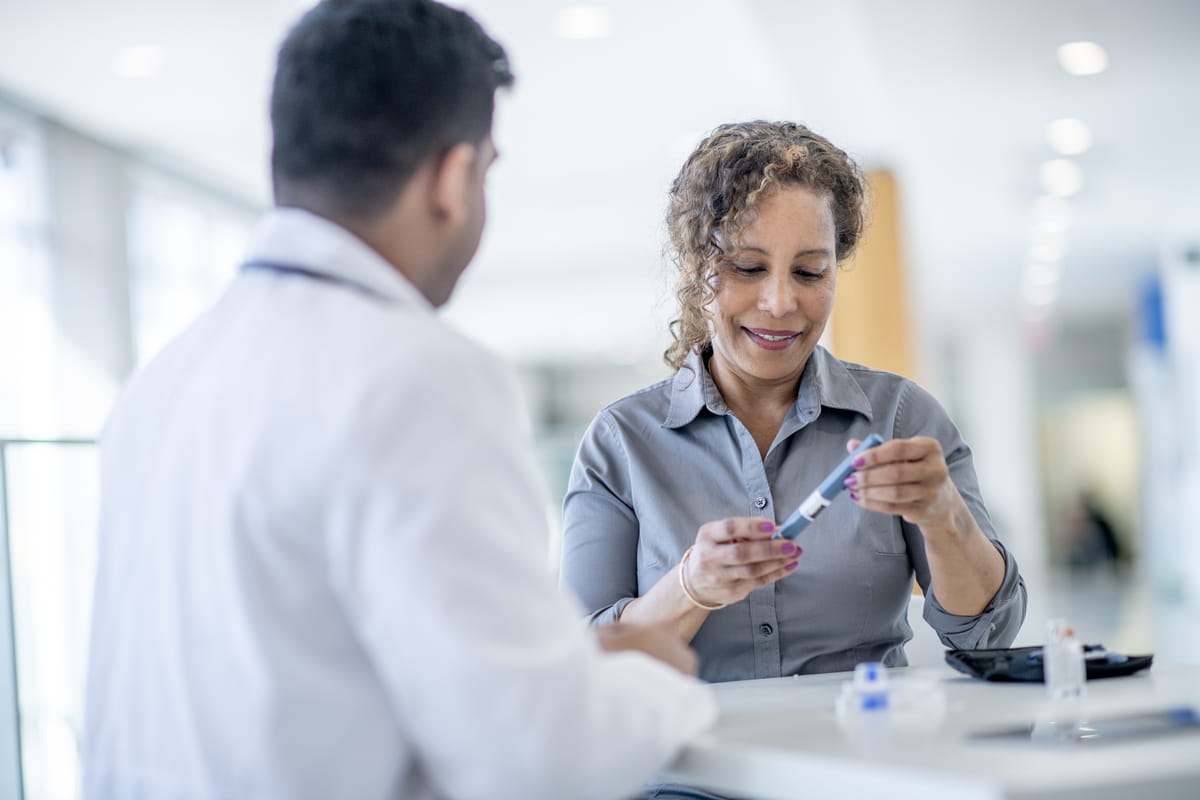 Doctor Explaining Diabetic Testing to a Senior Patient 
