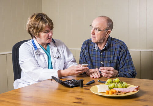 Diabetes patient receiving advice from a health care professional.