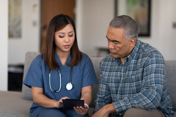 Young doctor with elderly patient