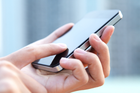 When to Call 911 Hand holding smartphone