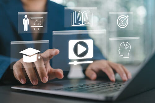 Concept of Online Education. Man use Online education training and e-learning webinar on the internet for personal development and professional qualifications. Digital courses to develop new skills.