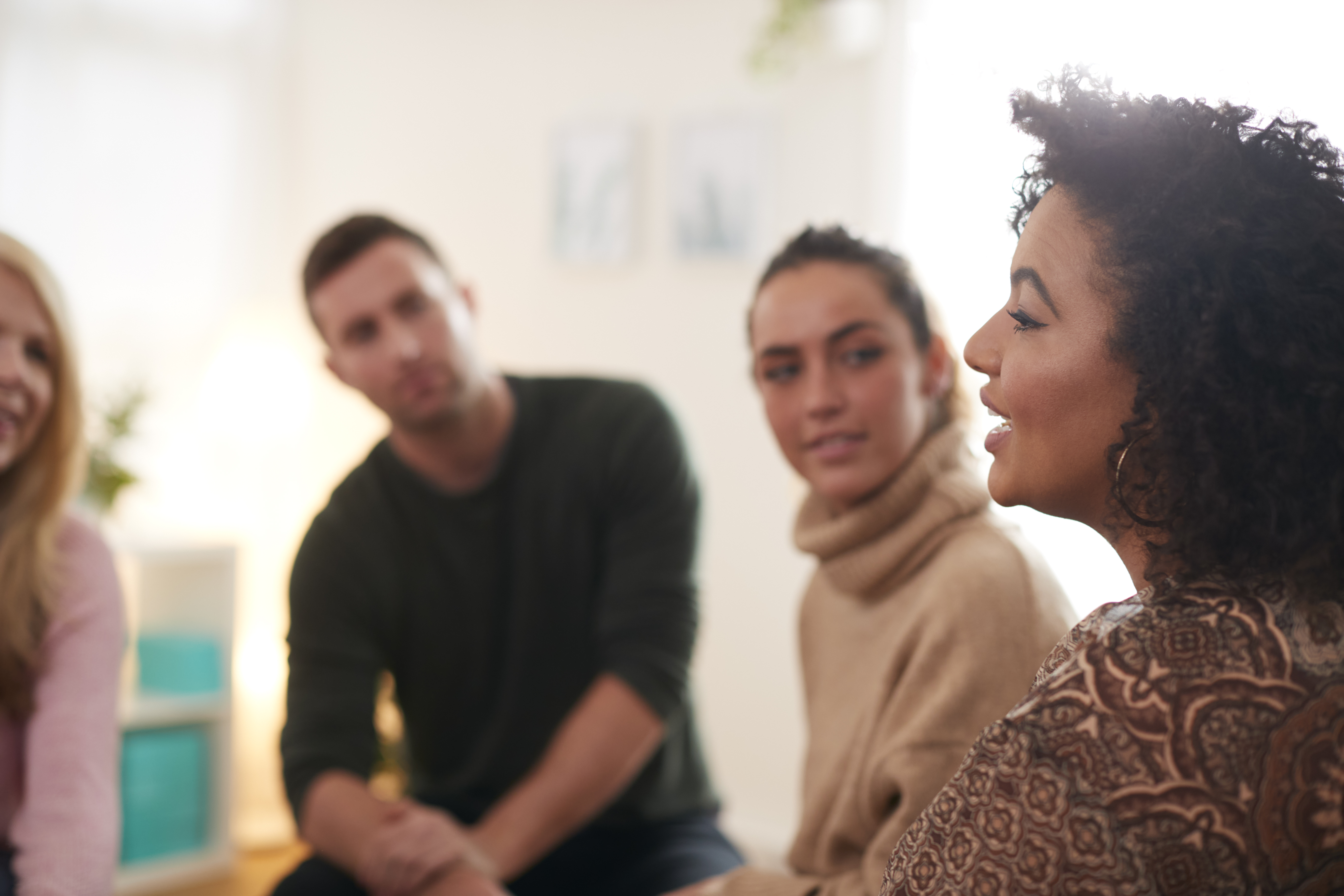 Woman Speaking At Support Group Meeting