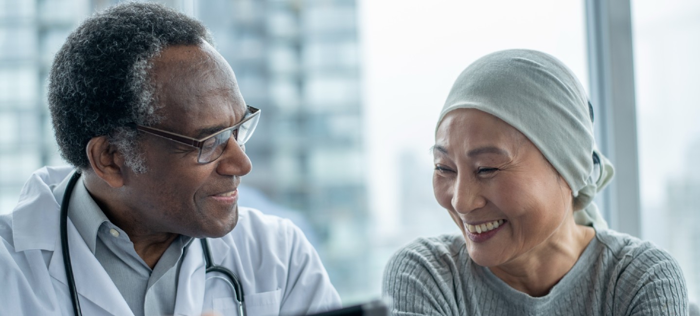 Woman with cancer talking to doctor